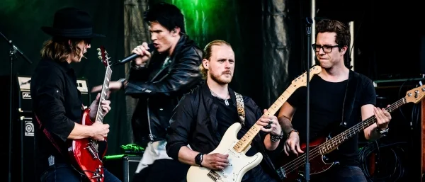 Rockband, symbolisiert das erfolgreiche Zusammenspiel von Führungskräften