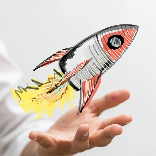 Eine skizzierte Rakete in rot und grau startet. Darunter sieht man eine Hand. Das Bild steht symbolisch für das Training "Growth Mindset und Innovationsfähigkeit".